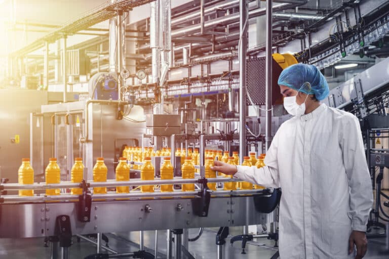 Conveyor belt with juice in bottles, Beverage factory, production line process
